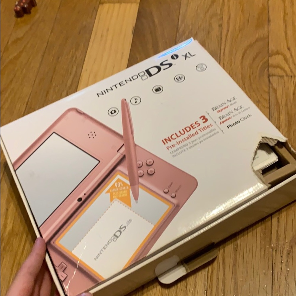 DS game and a pink Nintendo DS and a Nintendo DS